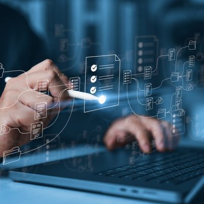 Document Management System, DMS with online file folder and cloud server icons. Man uses a pen to choose files from computer laptop for back up. Software for archiving, searching, managing files data.